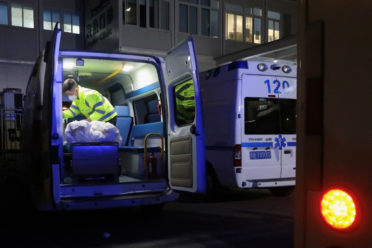 A worker cleans up inside an ambulance outside an emergency department of a hospital, amid the coronavirus disease (Covid-19) outbreak, in Chengdu, Sichuan province, China December 27, 2022.