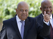 South Africa's Finance Minister Pravin Gordhan gestures as he arrives to deliver his 2016 budget address to the parliament in Cape Town, February 24, 2016.  REUTERS/Mike Hutchings