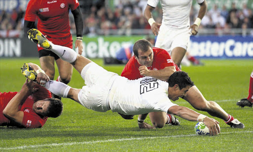 Shontayne Hape scores a try for England at Otago stadium in Dunedin during an ill-disciplined display by the former champions against lowly Georgia in pool B of the Rugby World Cup. Manager Martin Johnson was fuming after England conceded 14 penalties Picture: MARCOS BRINDICCI/GALLO IMAGES