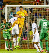 Goalkeeper Moeneeb Josephs of Wits makes a save during the CAF Champions League qualifying match between Bidvest Wits and Saint-Louisienne at Bidvest Stadium on February 18, 2017 in Johannesburg, South Africa.