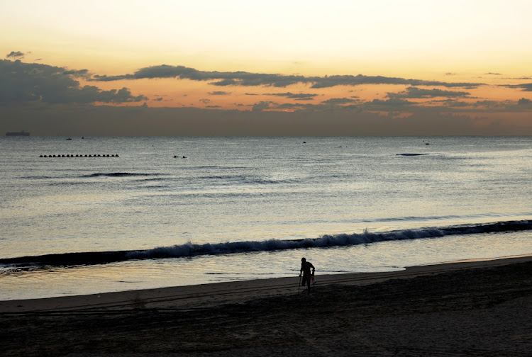 A disabled swimmer participates during the World Ocean Day Swim at the Point Waterfront in Durban