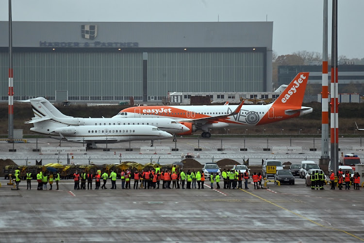 An aircraft of the airline Easyjet lands during the official opening of the new Berlin-Brandenburg Airport (BER) "Willy Brandt", in Schoenefeld near Berlin, Germany October 31, 2020.