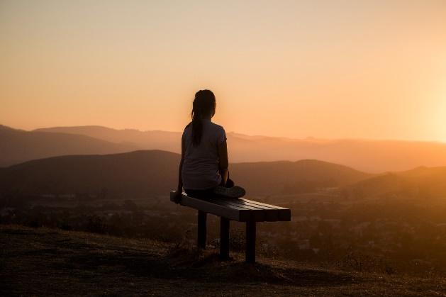 A person sitting on a bench

Description automatically generated with medium confidence