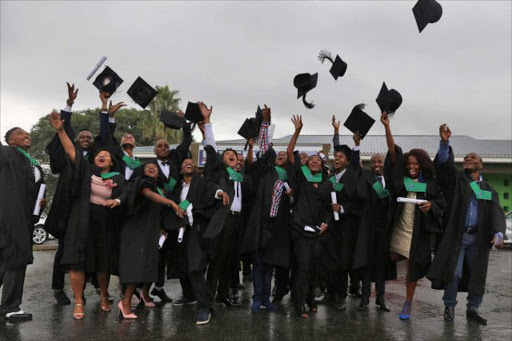 A BETTER FUTURE: Learnership participants from Duncan Village receive their NQF 5 certificates in information technology and system support at Gompo Hall yesterday Picture: SIBONGILE NGALWA