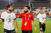 Egypt players Mohamed Hany (left), an injured Mohamed Salah (centre) and Mostafa Mohamed at the end of the 2023 Africa Cup of Nations match against Cape Verde at Felix Houphouet Boigny Stadium in Abidjan, Cote d'Ivoire on January 22 2024.