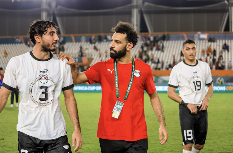 Egypt players Mohamed Hany (left), an injured Mohamed Salah (centre) and Mostafa Mohamed at the end of the 2023 Africa Cup of Nations match against Cape Verde at Felix Houphouet Boigny Stadium in Abidjan, Cote d'Ivoire on January 22 2024.