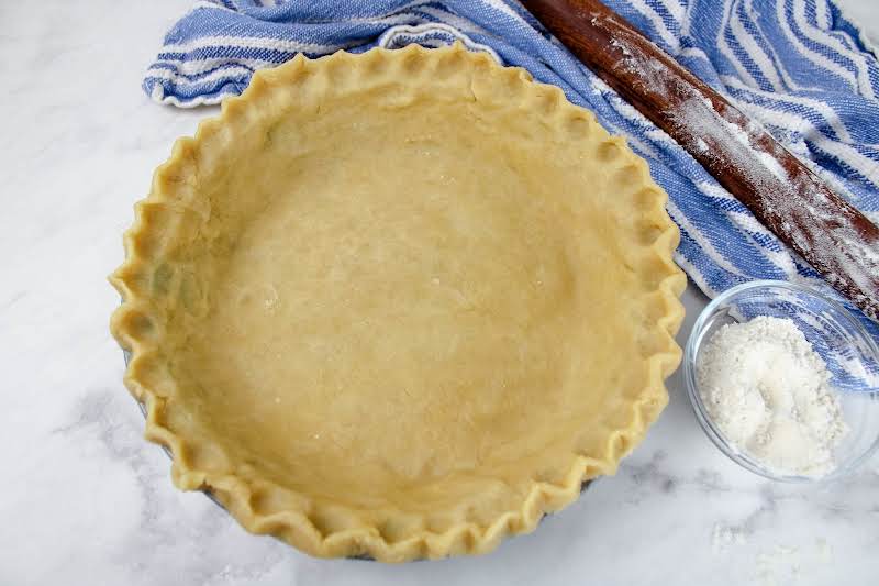 Foolproof Pie Crust Pressed Into A Pie Plate.