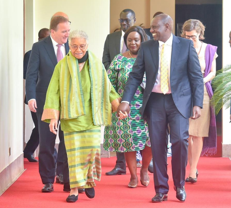 President William Ruto walking hand in hand with former President of Liberia Ellen Johnson Sirleaf on October 19,2022.