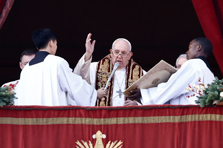 Pope Francis delivers his traditional Christmas Day Urbi et Orbi message to the city and the world from the main balcony of St. Peter's Basilica at the Vatican, December 25, 2022.