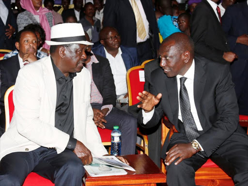 Deputy President William Ruto with ODM leader Raila Odinga during the funeral service of Privatisation Commission chair Henry Obwocha in Nyamira on Friday, August 17, 2018. /DPPS