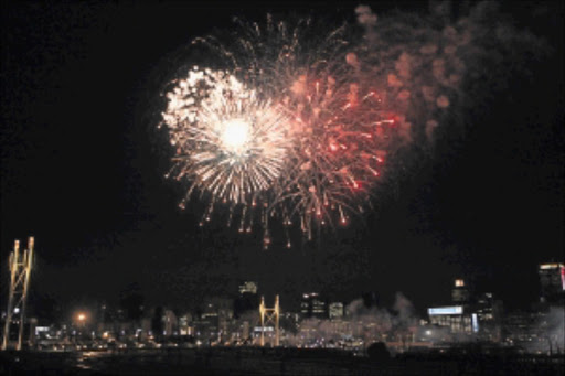 BIG BANG: Fireworks light up the sky above the Nelson Mandela bridge, venue for the start of the Jozi 10km race Photo: Mohau Mofokeng