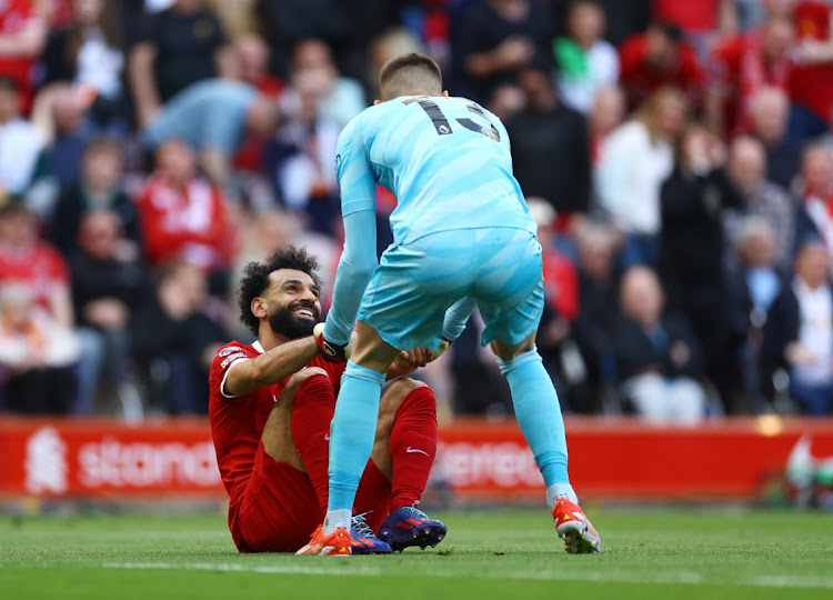Liverpool's Mohamed Salah is helped up Tottenham Hotspur's Guglielmo Vicario during the match at Anfield in Liverpool, Britain, May 5 2024. Picture: Carl Recine/Reuters