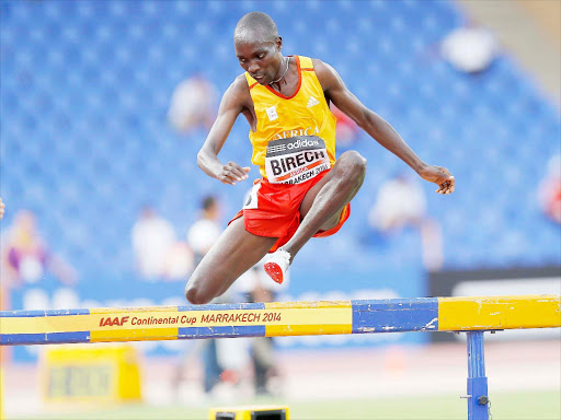 Jairus Birech of Team Africa clears the last barrier on his way to winning the men 3,000m-steeplechase gold medal at the IAAF Continental Cup. at the Le grand de Stade of Marrakech on September 14, 2014. Photo/Mohamed Amin/www.pic-centre.com (Morocco)