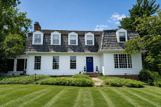 White house French architecture neat garden in this luxury property for sale in Potomac ($1,895,000)