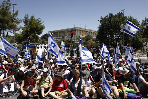 Tens of thousands of Israelis converged on the Knesset building in Jerusalem to protest against the passage of a new law that would curb the powers of courts. Picture: BLOOMBERG