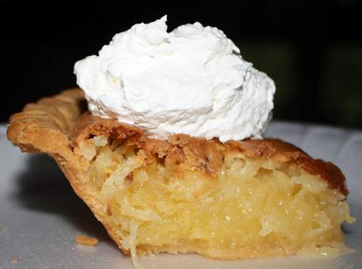 Toasted Coconut Pie.  Garnished with whipped cream. 