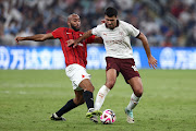 Rodri of Manchester City is challenged by Jose Kante of Urawa Red Diamonds in the Fifa Club World Cup semifinal at King Abdullah Sports City in Jeddah, Saudi Arabia on Tuesday night. 