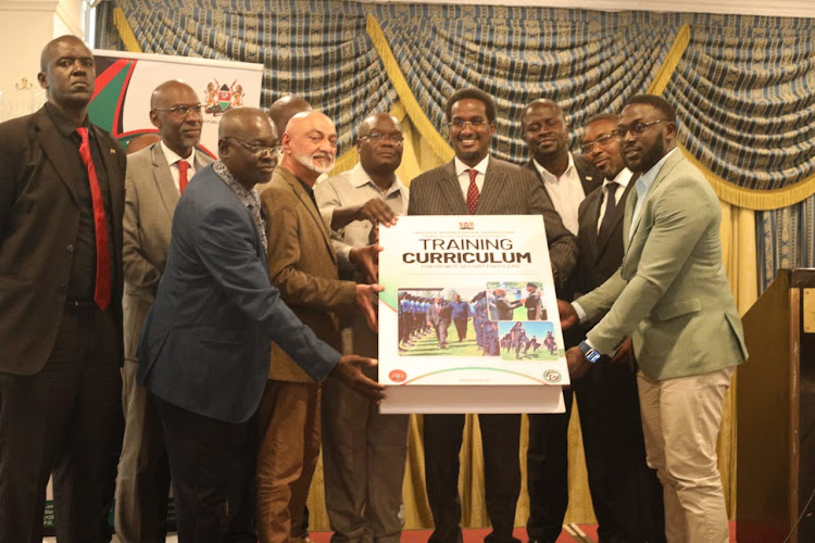 Director General, Private Security Regulatory Authority Fazul Mahamad (center ) flanked by Private Security stakeholders (and bouncers) during the launch of Nationwide Security Vetting, Training & Licensing of bouncers,Event security and other personell in Entertainment, Recreational and Sporting establishments at the Sarova Stanley Hotel,Nairobi. January 10th,2024