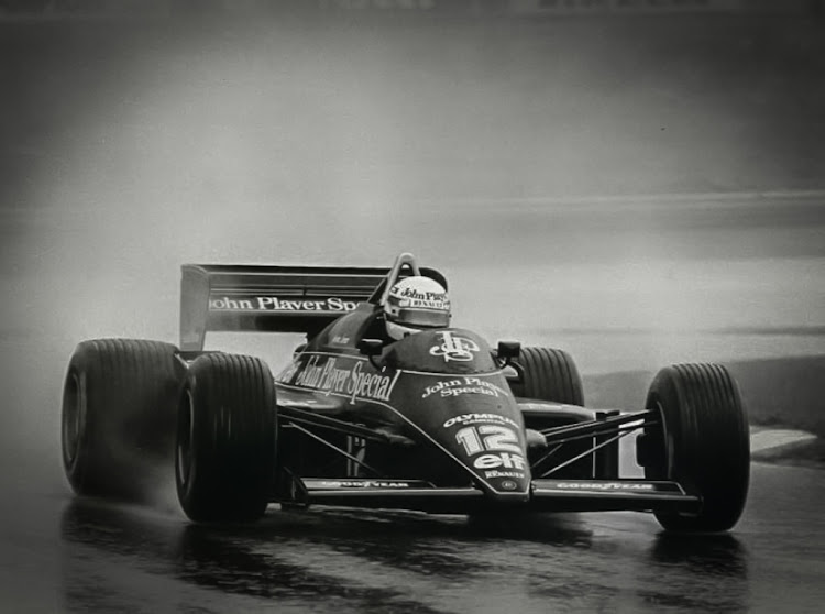 Ayrton Senna racing in the 1985 Portuguese Grand Prix at Estoril.