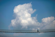 A man walks on the suspension bridge in Kathmandu, Nepal. 