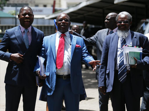 Uasu chairman Muga K'olale, secretary general Constantine Wasonga and KUSU secretary general Charles Mukwaya after a meeting with the parliamentary Education committee on April 12 last year