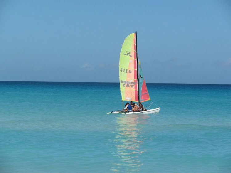 A HobieCat catamaran in the clear tropical waters of Cuba. 