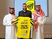 Karim Benzema poses holding the jersey of Saudi Arabian soccer team Al Ittihad in this handout photo obtained by Reuters on June 6 2023.  