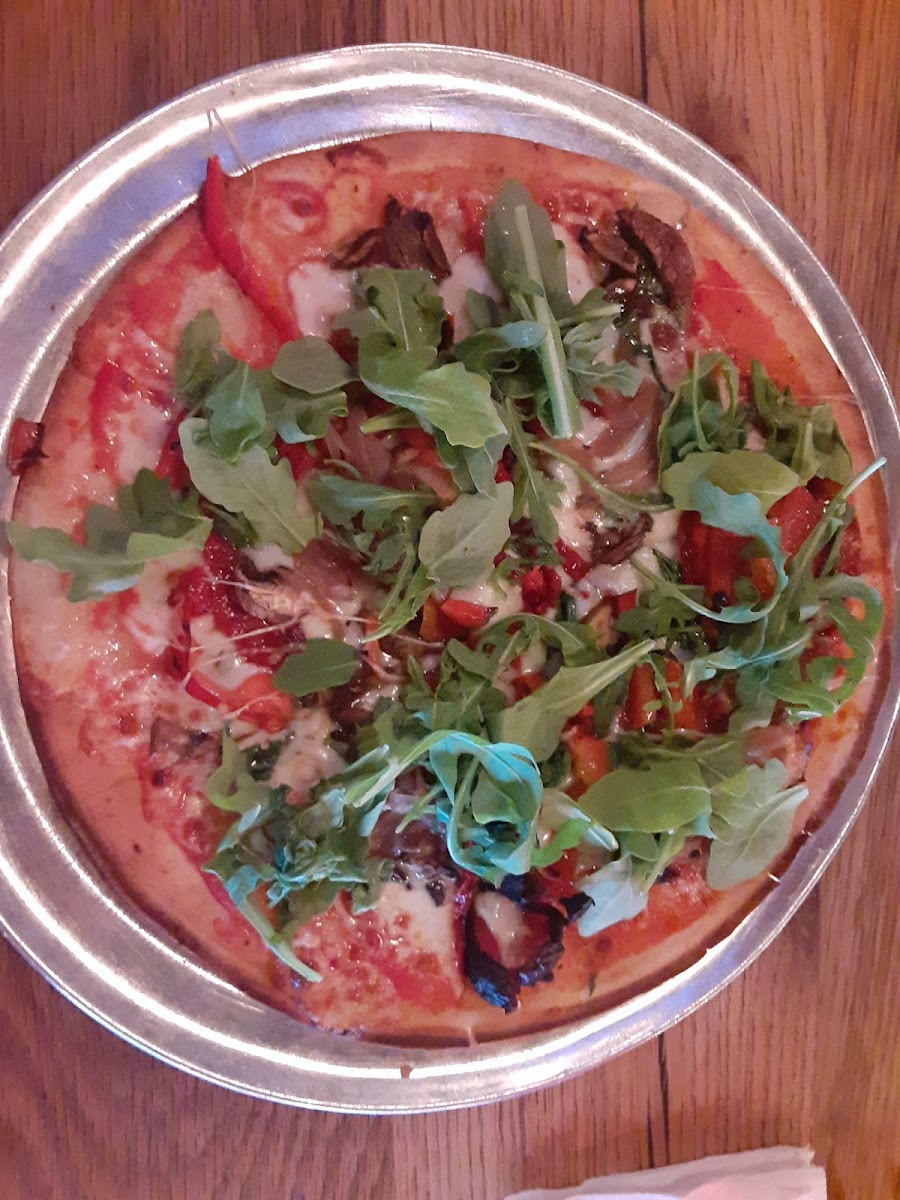 Gluten free crust pizza is customized with my choices of veggies