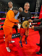 SA's mini fkyweight champ Siyakholwa Kuse with trainer Makazole Tete.