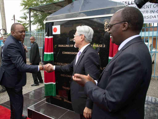 President Uhuru Kenyatta and Transport CS James Macharia during the launch of the dualling of Ngong Road Phase II and the commissioning of Phase I, March 22, 2018. /PSCU