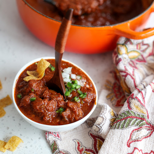 This authentic Texas Chili is made with tender chuck roast, onions, jalapeno peppers, garlic, and crushed tomatoes all simmered in an absolutely perfect chili paste made with a perfect blends of peppers and spices. 
