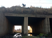 The boy sustained a head injury and was found at the bottom of an embankment, next to a stream. 