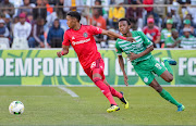 Orlando Pirates winger Vincent Pule (L) leaves Bongani Sam (R) of Bloemfontein Celtic in his wake during the Absa Premiership match at Toyota Free State Stadium in Bloemfontein on August 19 2018.