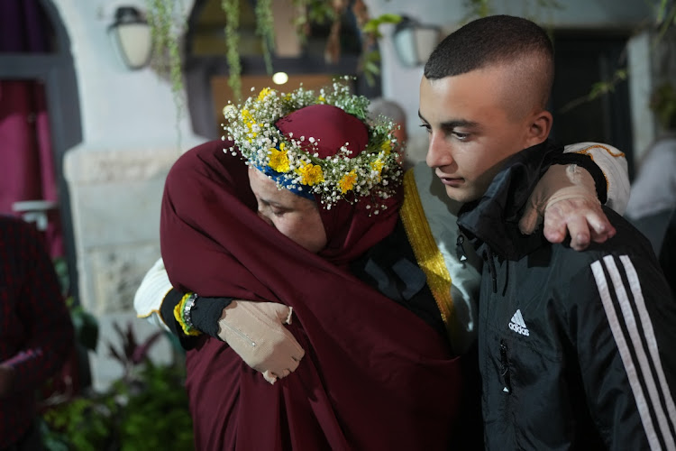 Palestinian prisoner Israa Jaabis is welcomed by her family after being released as part of a deal between Israel and Hamas, November 26 2023. Picture: ERIK MARMOR/GETTY IMAGES