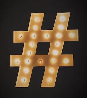 Hashtag symbol  decorated with light bulbs