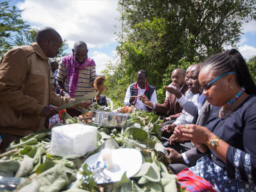 ODM leader Raila Odinga (seated at far end) when he joined Kajiado leaders for a thanksgiving at Dalalekutuk, Kajiado Central on Saturday, April 29, 2018. /EVANS OUMA