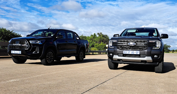 The Toyota Hilux, left, remains South Africa's top-selling bakkie, but the new Ford Ranger, right, is starting to put up a fight. Picture: DENIS DROPPA