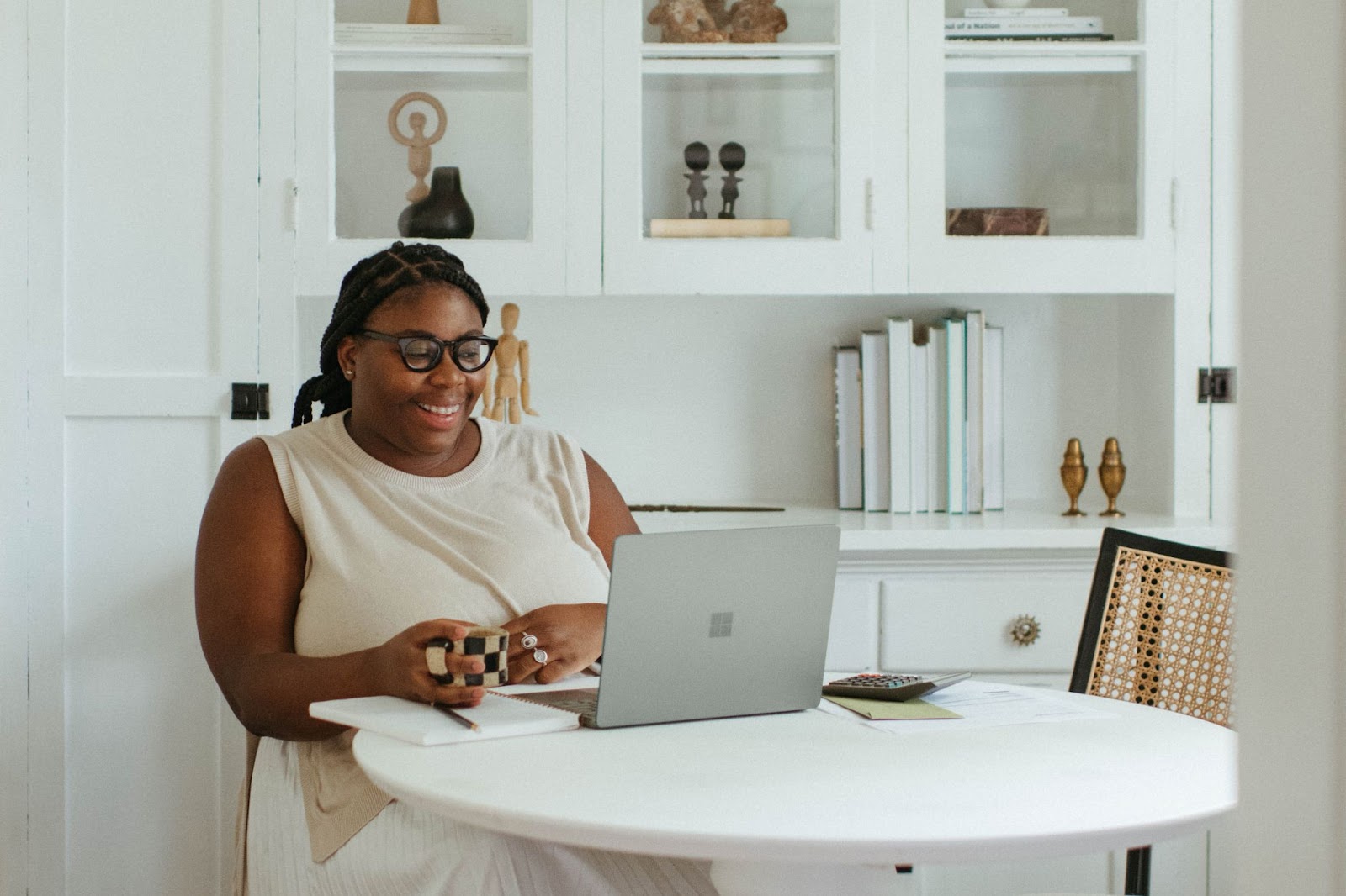 A girl looking at a surface laptop