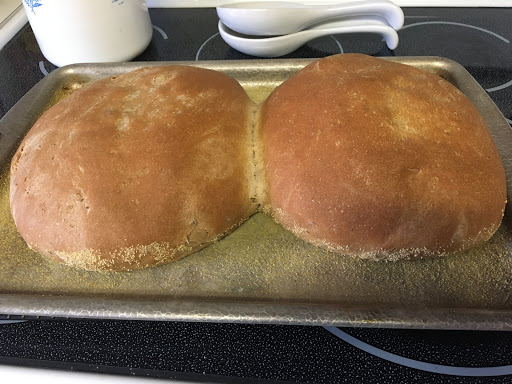 the loaves are baked and ready to cool on a wire rack.  