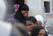 Community members at the funeral of six-year-old Stacey Adams in Eastridge, Mitchells Plain. Stacey's body was found opposite her grandmother's house in a shallow grave next to a Wendy house.