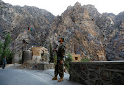 An Afghan National Army soldier stands guard at the check post at Mahipar, on Jalalabad-Kabul highway Afghanistan July 8, 2021. 