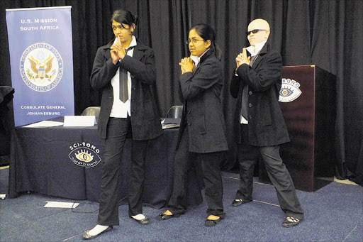 COVERT OPERATIONS: Tasmiayh Hoosen, Prinesa Reddy and Abongile Xhantini from the Oprah Winfrey Leadership Academy for Girls used play-acting to get their presentation on climate change and food security across Picture: SUPPLIED