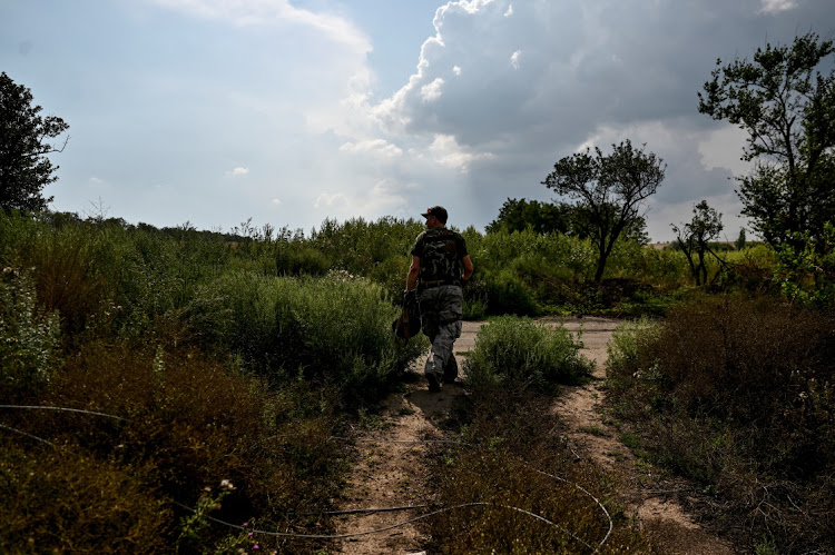 A Ukrainian service member patrols an area near a frontline, amid Russia's attack on Ukraine continues, in Zaporizhzhia Region, Ukraine August 18, 2022.