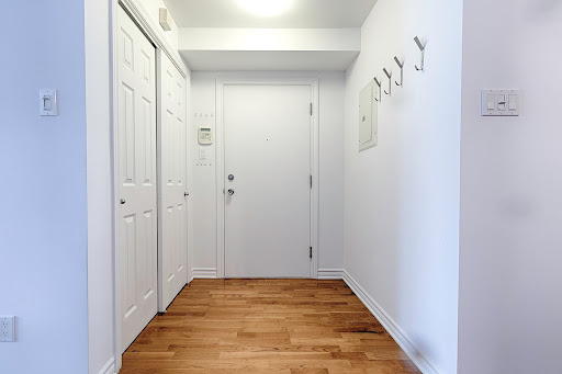 Entryway with closet and white door in this luxury house for sale in Montreal ($319,351)