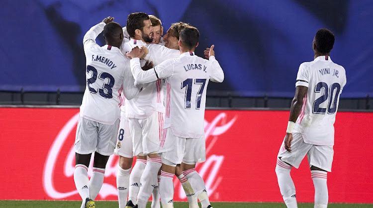 Toni Kroos of Real Madrid celebrates after scoring his team's second goal with his teammates during the La Liga Santander match between Real Madrid and FC Barcelona at Estadio Alfredo Di Stefano on April 10, 2021 in Madrid, Spain.