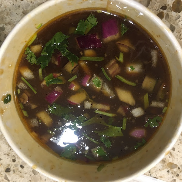 Beef consommé that comes with the Quesa Birria tacos- liquid gold.