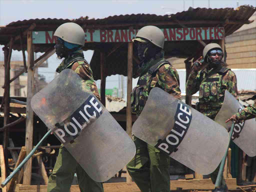 Anti-riot police officers during a patrol in Kondele, Kisumu County, August 11, 2017. /MAURICE ALAL