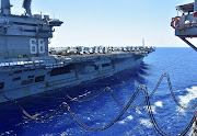 The US Navy aircraft carrier USS Nimitz receives fuel from the Henry J. Kaiser-class fleet replenishment oiler USNS Tippecanoe. File photo 