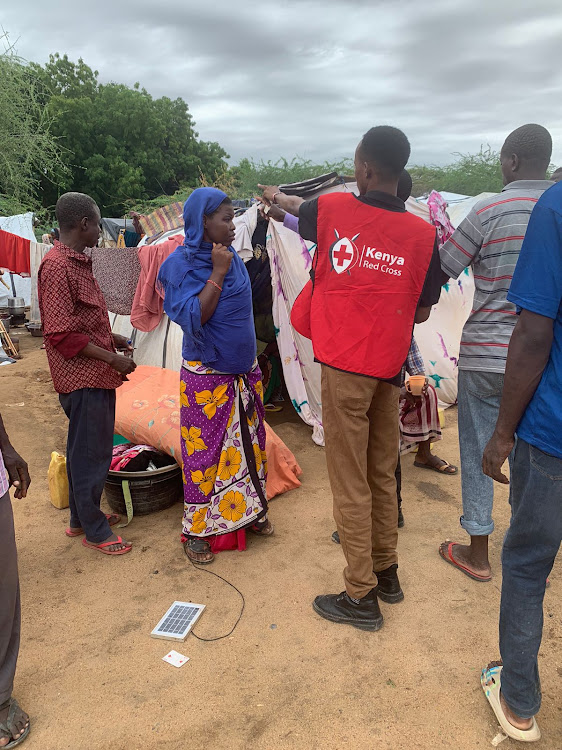 A Red Cross official doing registration of IDPs at Hyuga girls primary in Garissa.