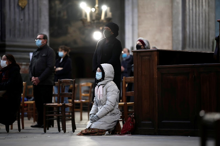 Devotees attend Sunday mass at the Saint-Sulpice Church under strict sanitary rules, after one month interruption due to the coronavirus disease (COVID-19) in Paris, France, November 29 2020.